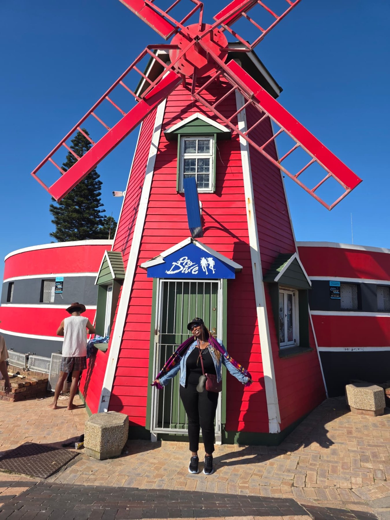 A stop beside the red windmill